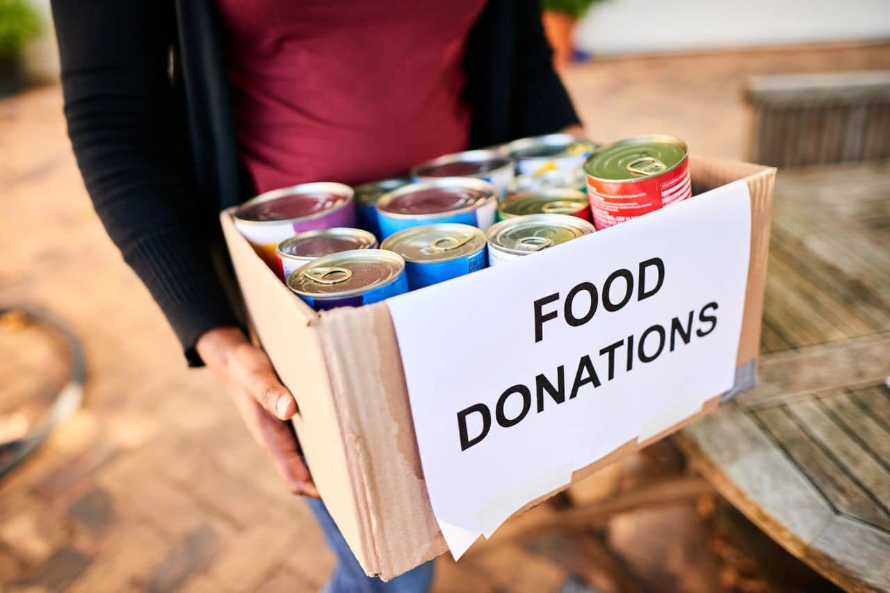 Person holding Food Donation Box